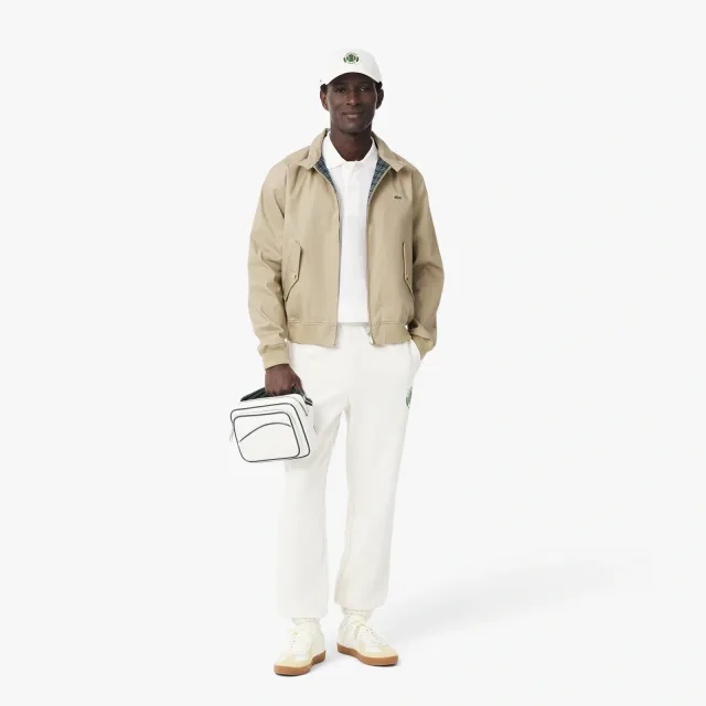 Поло Lacoste в 2027 году: как носить символ бренда вне корта: Оригинальное поло L.12.12, classic fit, реальный каталожный ракурс 7